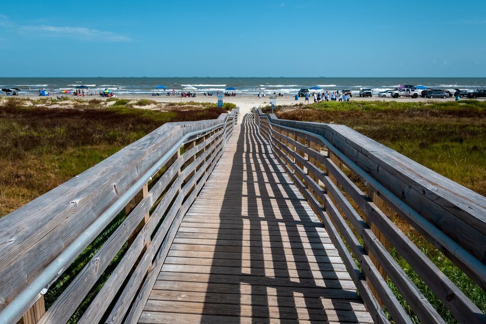 view of a boardwalk leading to east beach in galveston