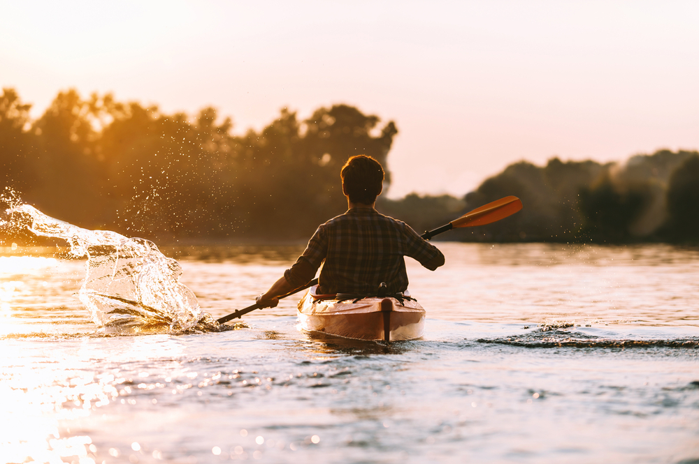 man kayaking alone beaches in austin