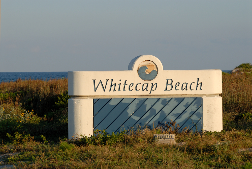 board with whitecap beach