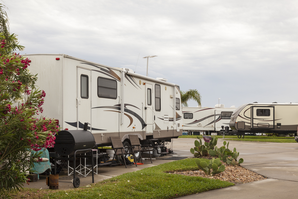 Rv park with several RVs parked beach camping in texas