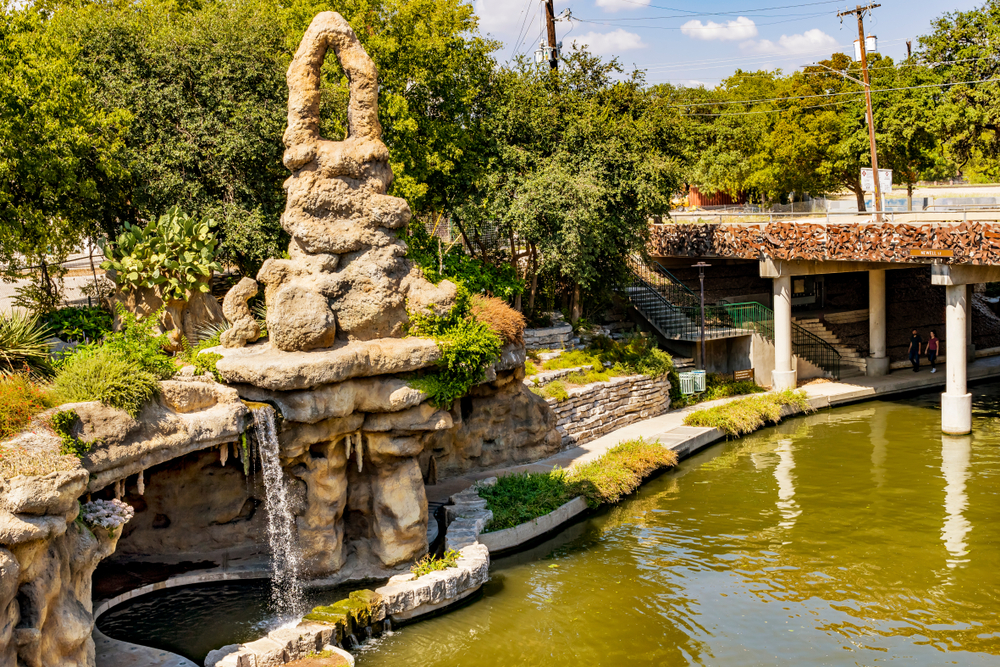 Grotto stone sculptures with waterfall over the roacks one of the best places to visit in San Antonio