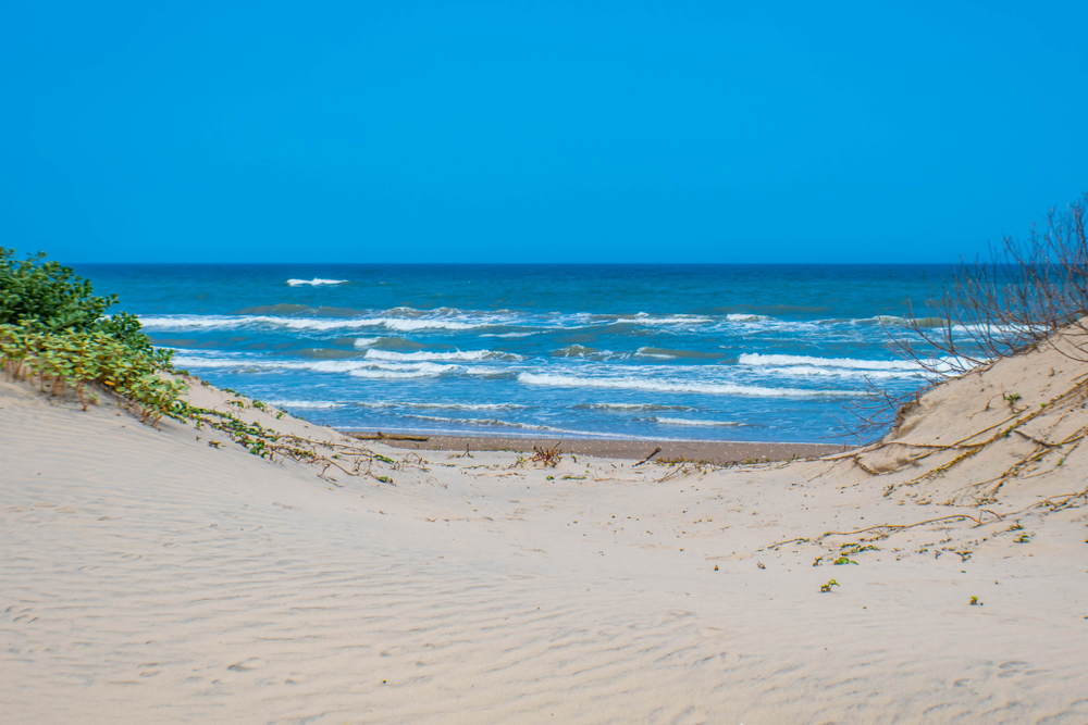 Sandy beach with blue ocean water beach camping in texas