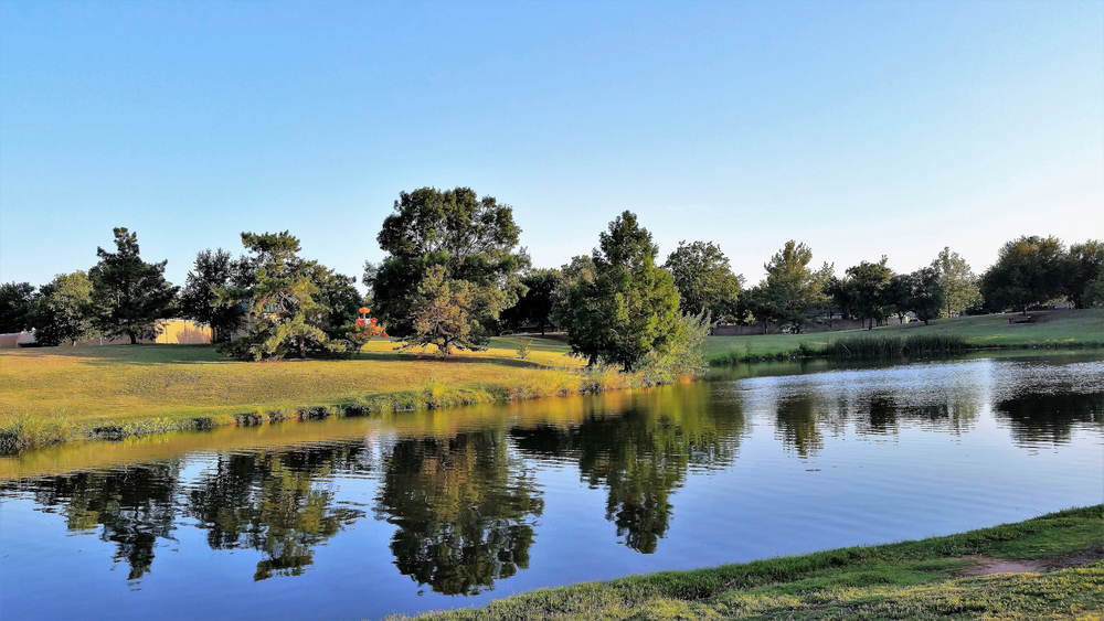 small creek surrounding by trees and greenery things to do in wichita falls