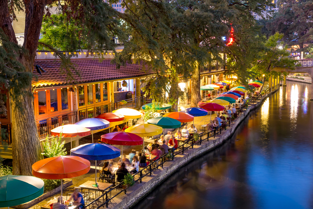 Colorful umbrellas on a river walk weekend getaways from houston