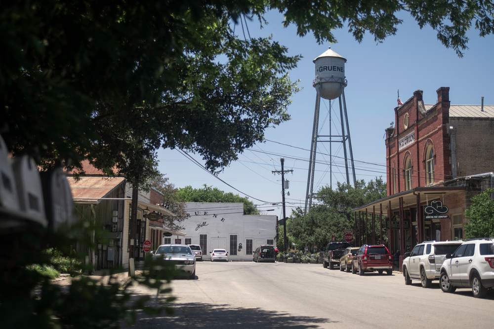 Downtown Gruene with a water tower and old buildings.