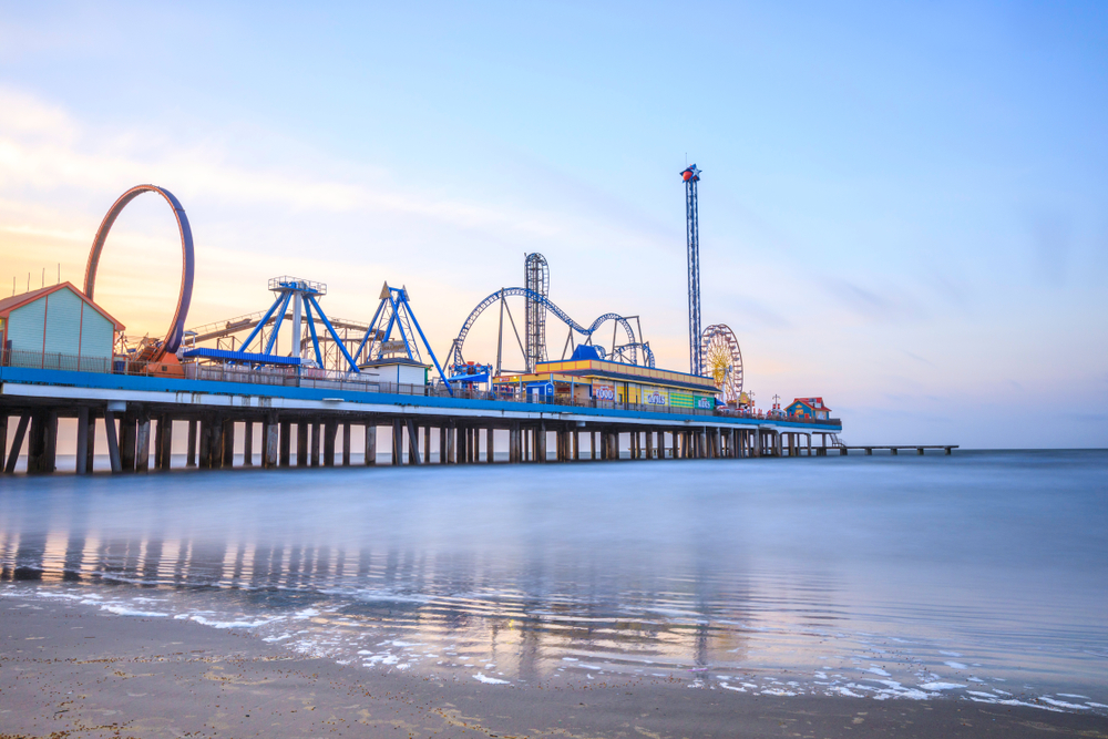 Pleasure Pier in Texas with roller coasters, Ferris wheel and other rides 