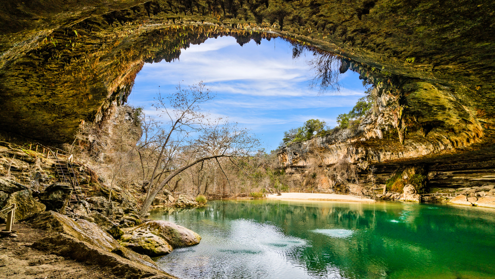 Natural pool at Hamilton Pool Preserve with cavernous surrounding