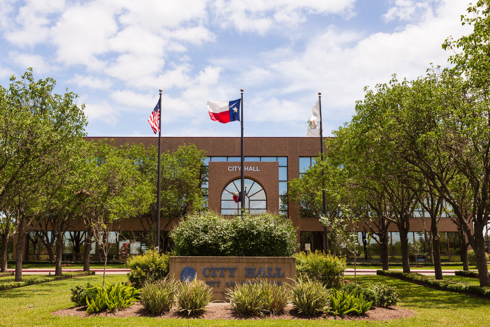 City Hall building of Pearland, Texas with American and Texas flag poles