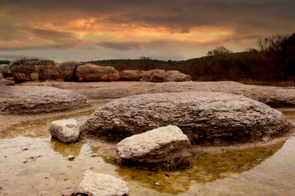 Big Rocks surrounded by water at Big Rocks Park one of the hidden gems in Texas