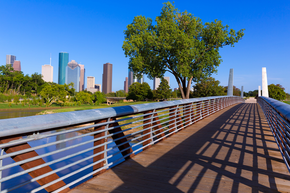 a look at the Houston skyline from a bridge at Memorial Park on a sunny day