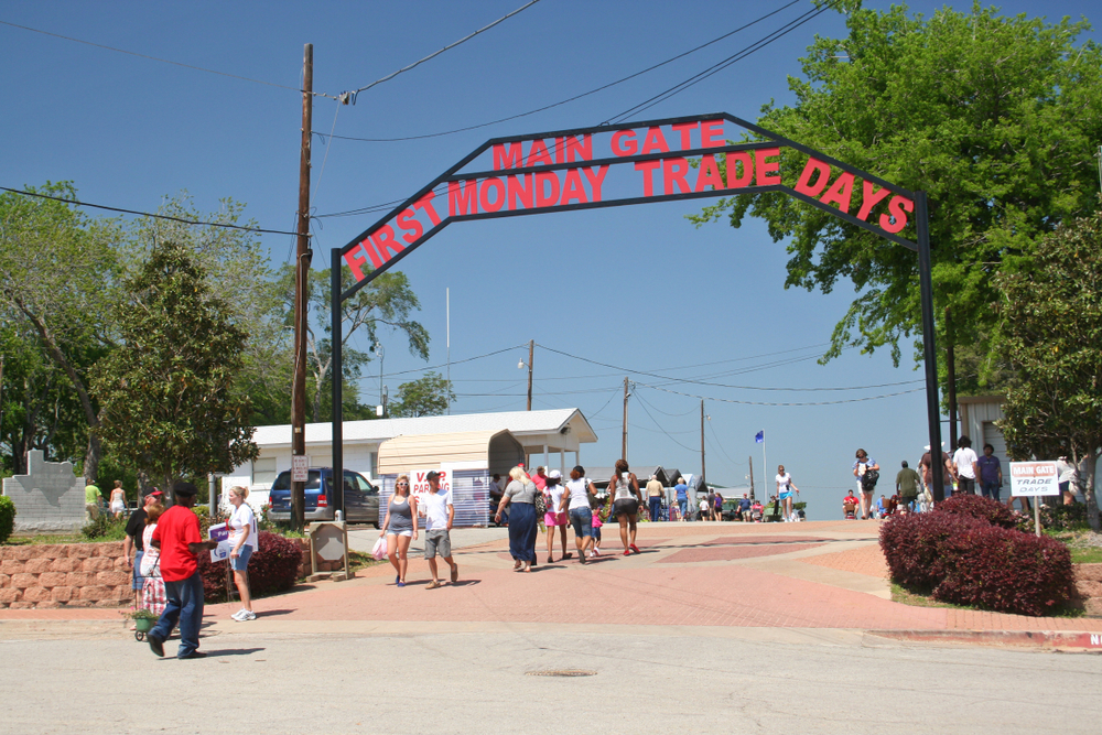 People walking through the main gate for Canton's Trade days flea market.