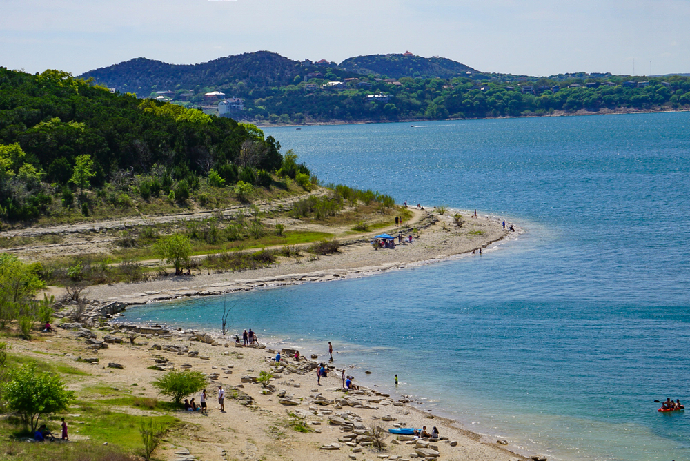 A view of the beach at Overlook Park, with people relaxing on a sunny day