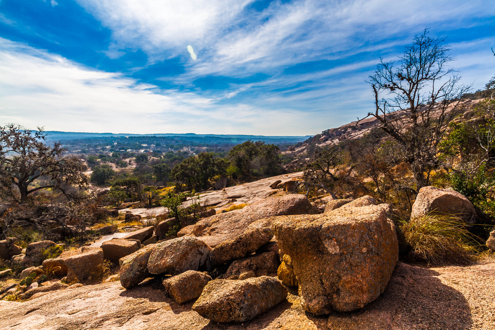 Rocks at Enchanted Rock under a bright blue sky.