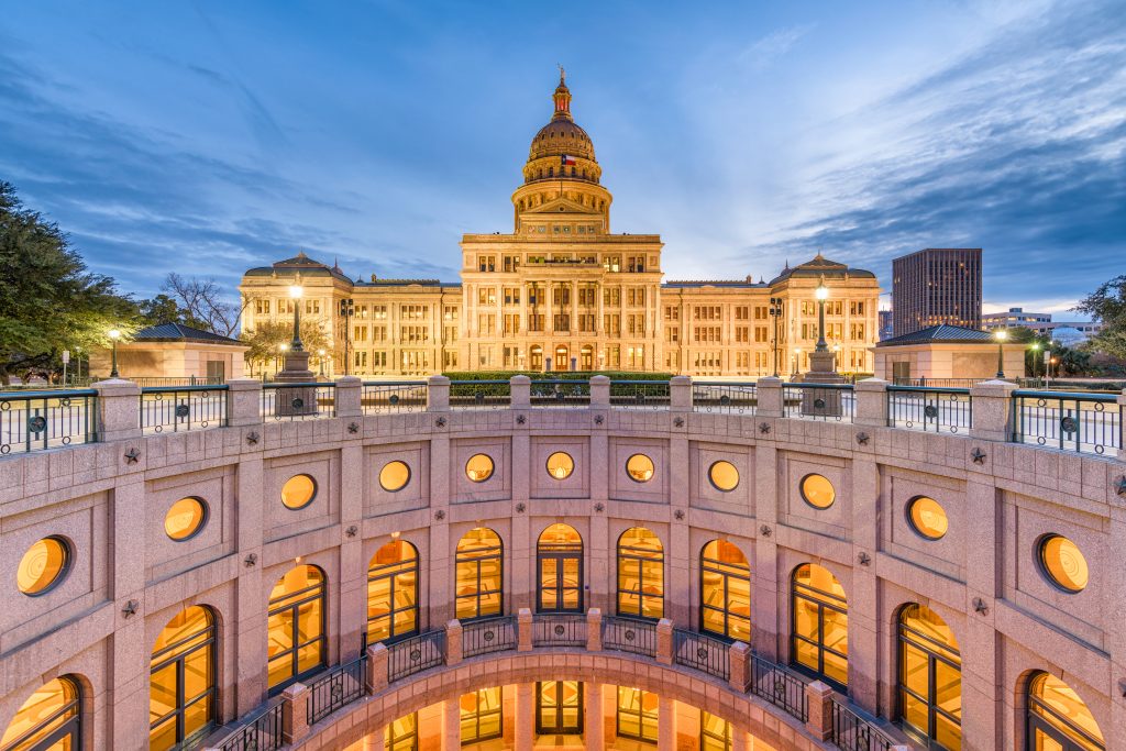 The exterior of the rotunda at Texas' 
Capitol building at night