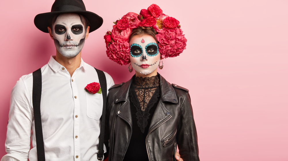 A couple with beautiful face paint of the Day of the Dead Celebrations at the Mexic-Arte Museum