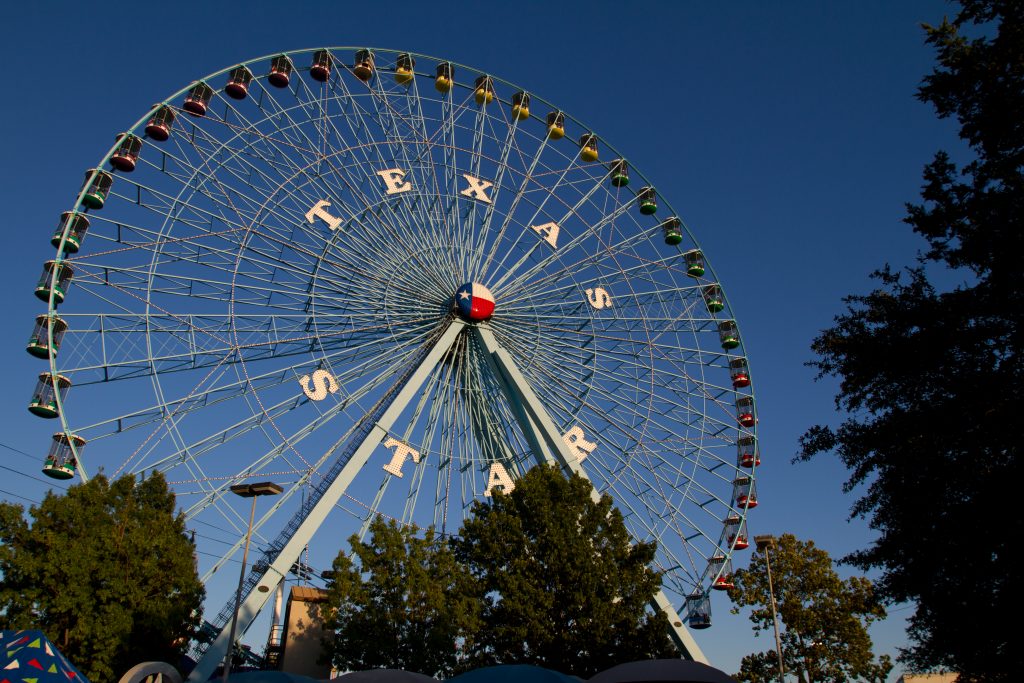 Ferris Wheel labeled with Texas State Fair one of the largest amusement parks in Texas