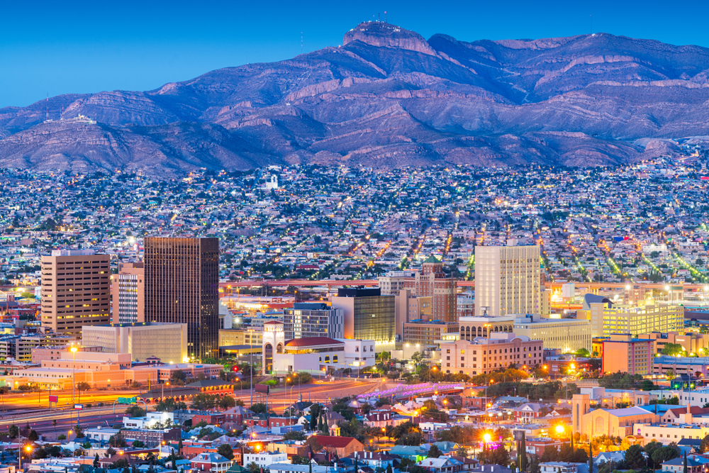 View of El Paso at night with mountains in the background 
