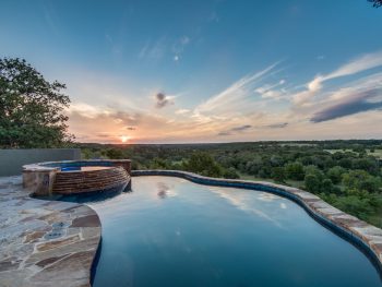 a pool at sunset at one of the best airbnbs in san antonio