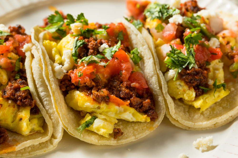 breakfast tacos with eggs, salsa, in tortillas