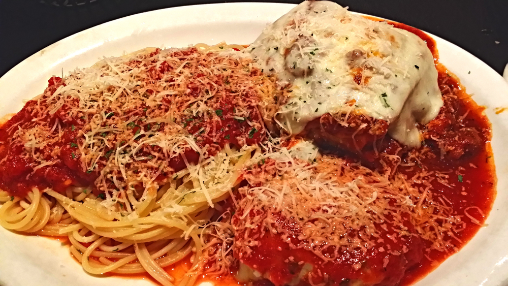 a trio of pasta, lasagna, spaghetti and manicotti