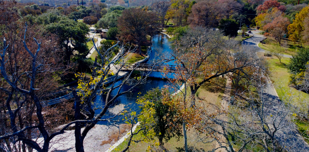 New Braunfels Texas where the river flows through a treed park area