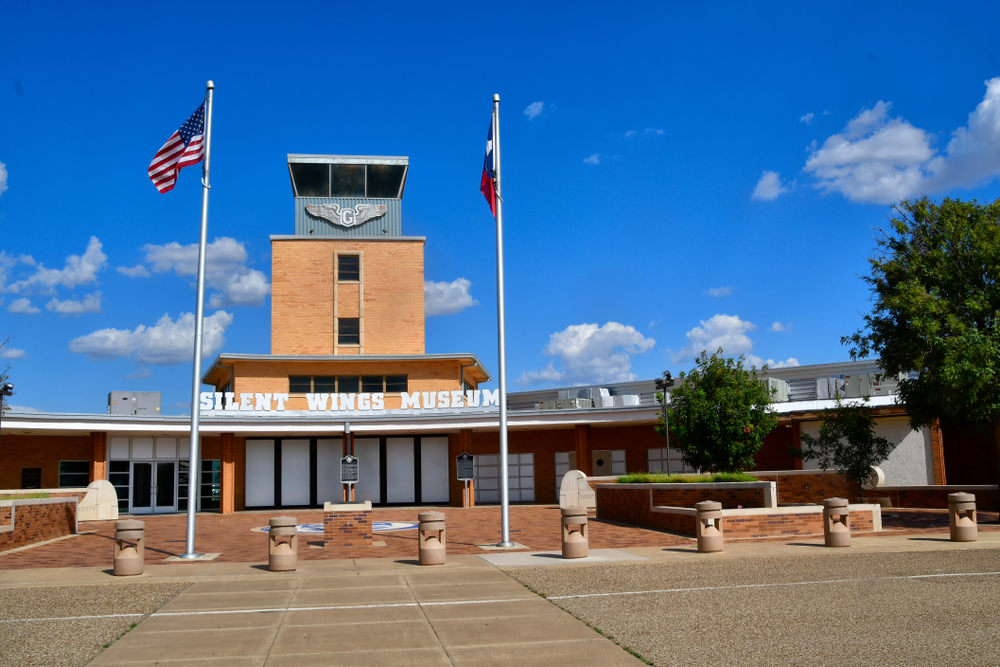 The exterior of the Silent Wings Museum, one of the best things to do in Lubbock. It is a stone building that resembles and old school.