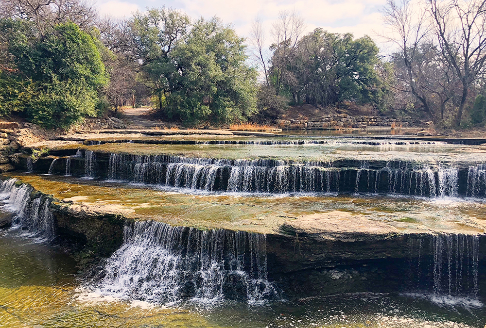 Airfield Falls, a small layered waterfall with a light flow of water