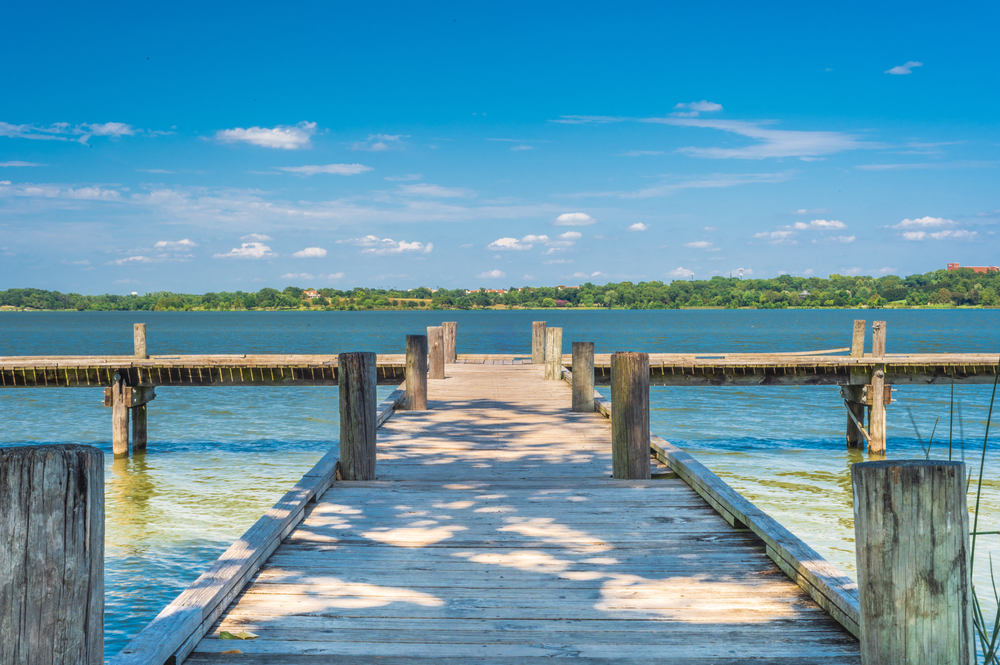 Wooden dock overlooking White Rock Lake one of the best beaches in Dallas.