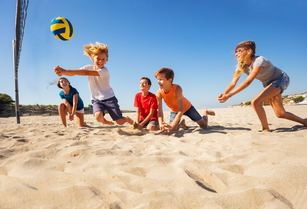 kids playing volleyball at McGee Beach