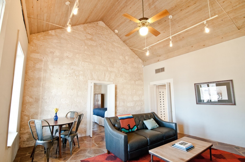 The original 1858 limestone walled living room of the Historic Cottage. 