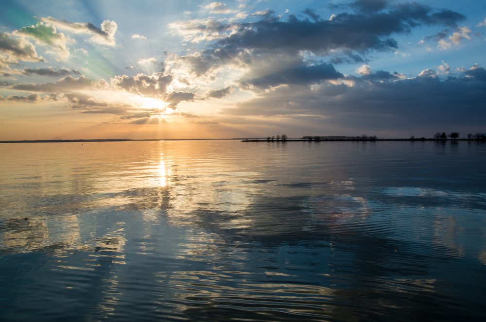 sunset over reflective waters at Lake Livingston