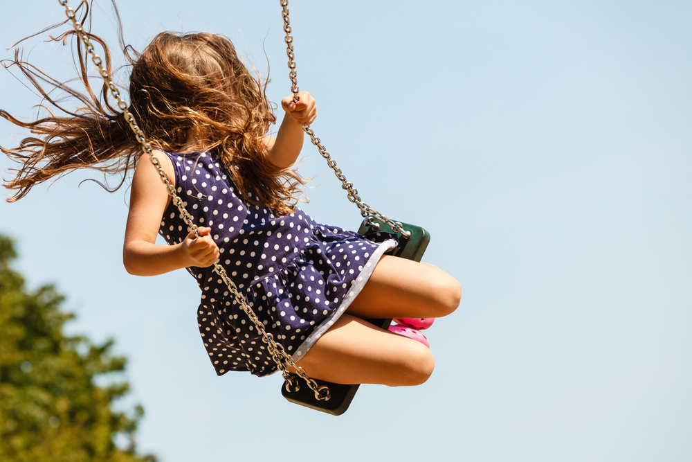 girl swinging in MacArthur Park!