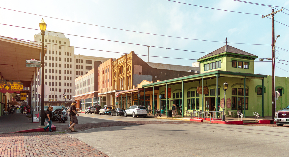 The strand features historic buildings like this green shop and victorian architecture 