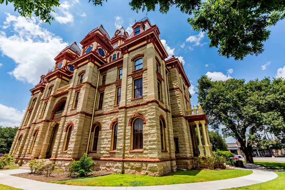 The stunning Country courthouse built from limestone and brick int eh center of town in Lockhart Texas