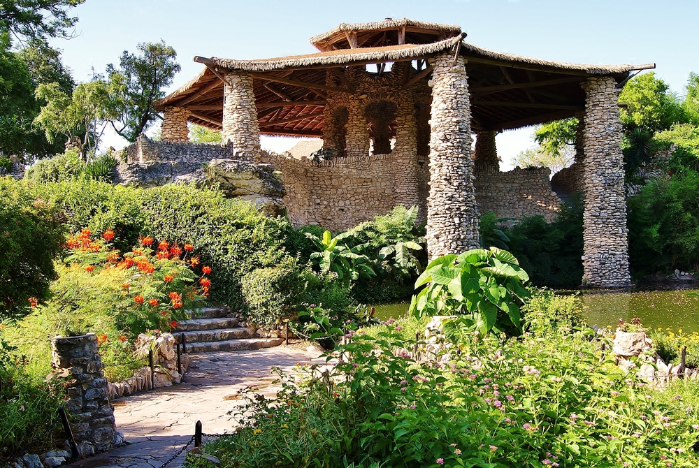 View of a pavilion surrounded by plants and flowers at tea garden on list of best things to do in San Antonio 