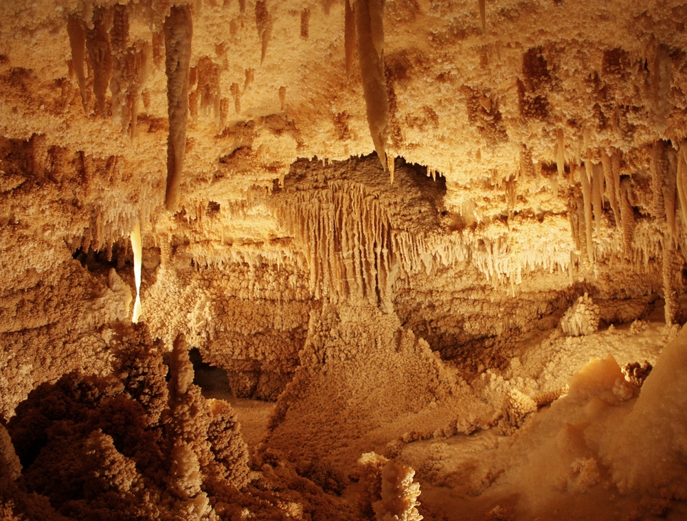 Off-white stalactites and other cave formations at caverns in Texas