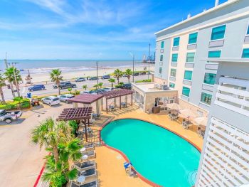pretty view of a pool at one of the galveston hotels on the beach in texas