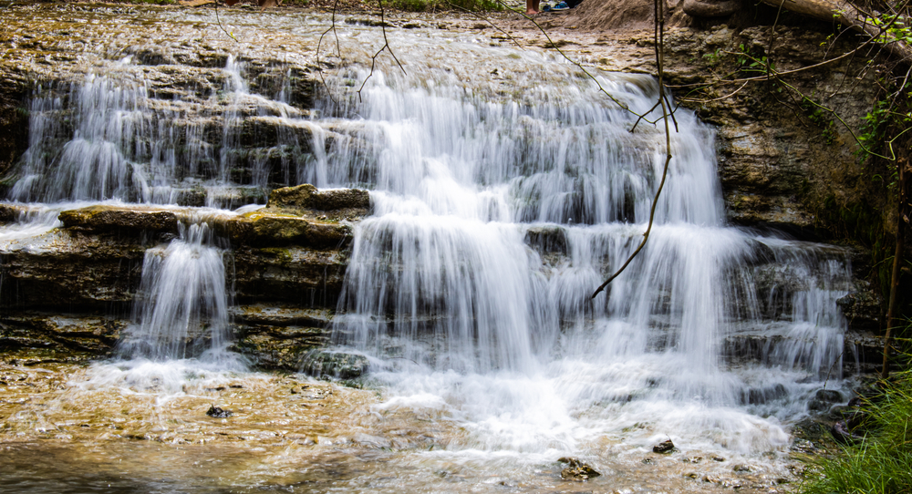 A waterfall at Chalk Ridge Falls Park. A perfect stop on your Dallas to Austin drive