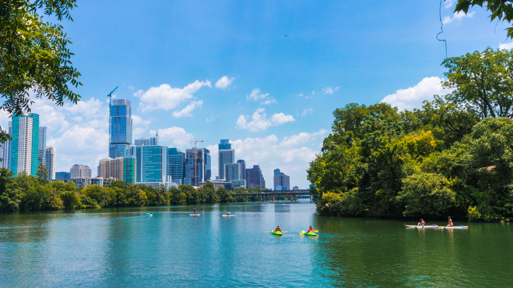 For a fun date night in Austin, consider touring by the skyline like in this photo, but with a twist: kayak to some wonderful spots!
