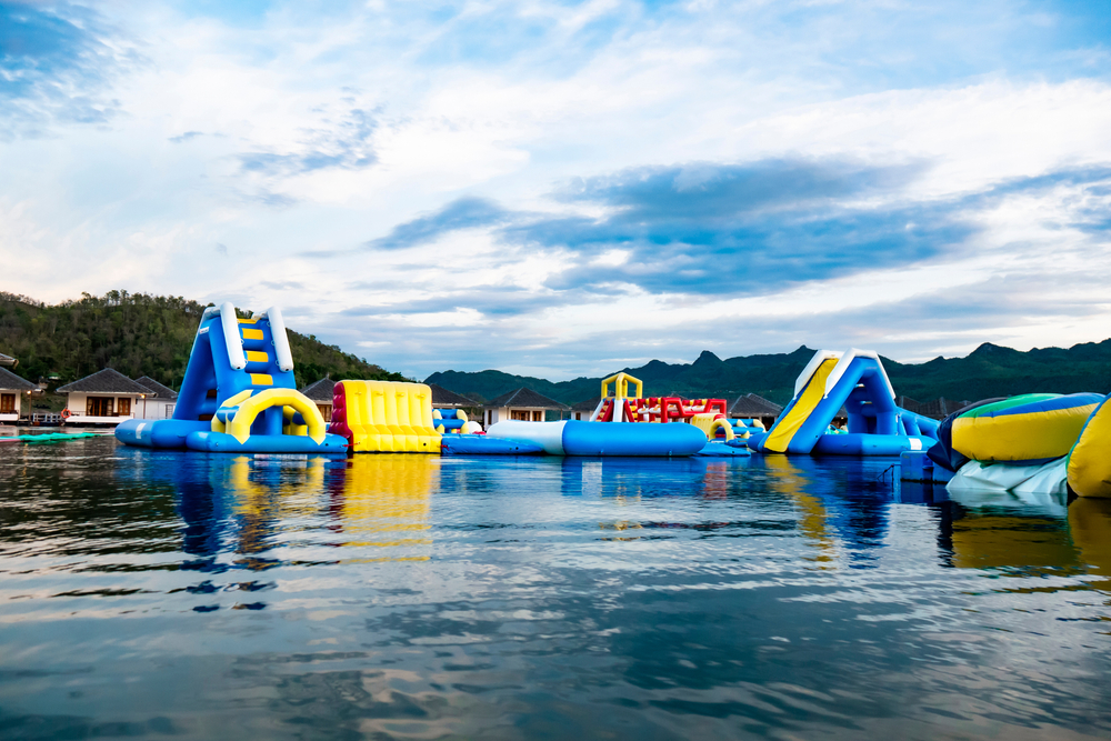 Photo of Floating waterpark obstacle course at Big Rivers Waterpark in New Caney, Texas. One of the most adventurous water parks in Texas. 