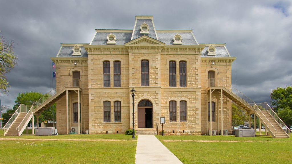 Blanco courthouse with a grey cloudy sky in the background