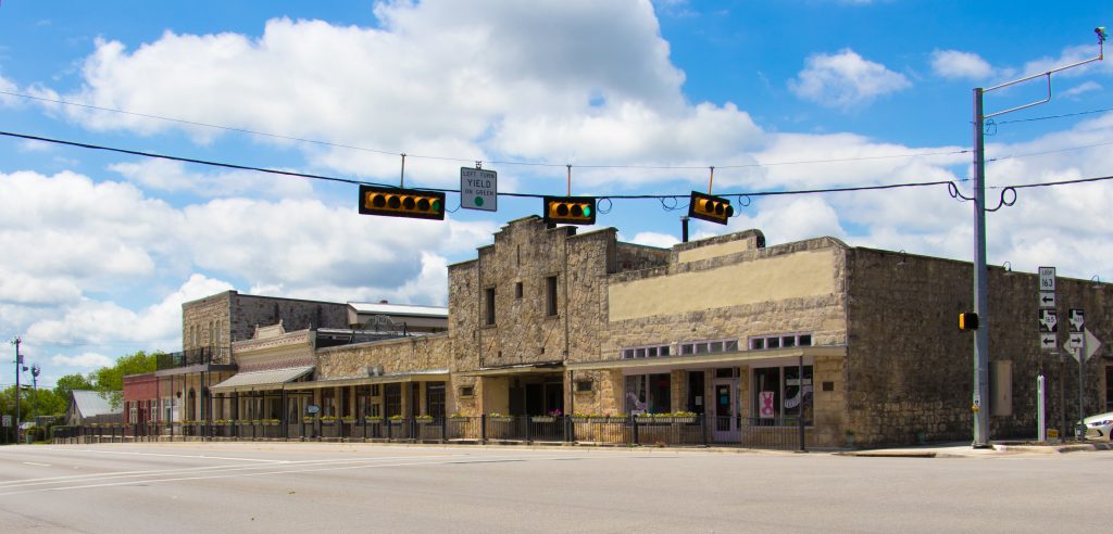 Downtown blanco shops with a street light 