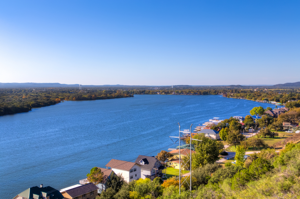 Photo of the shoreline along Lake LBJ, one of the best lakes near Austin for vacationers. 