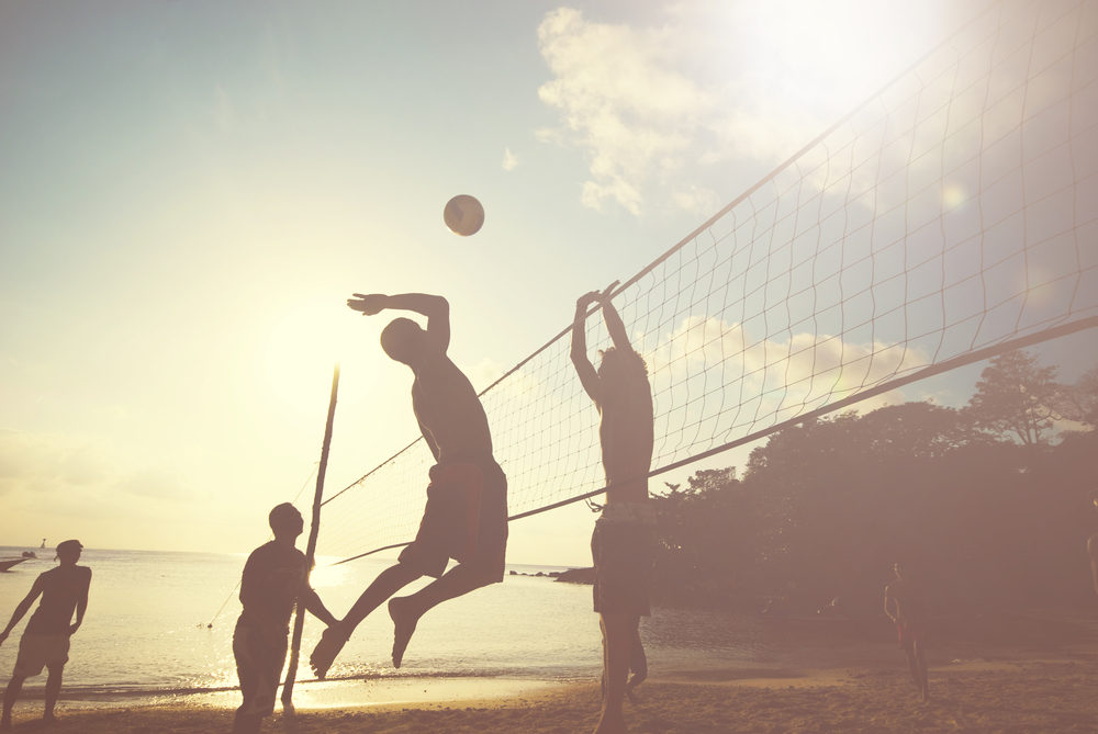 Photo of people playing volleyball at Lake Walter E. Long, one of the best lakes in Austin. 