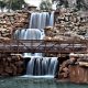 cascading waterfall with a bridge in front of it things to do in wichita falls