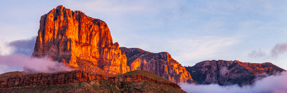 During sunset, El Captian, one of the mountains in Texas that is also in the Guadalupe range, glows orange. 