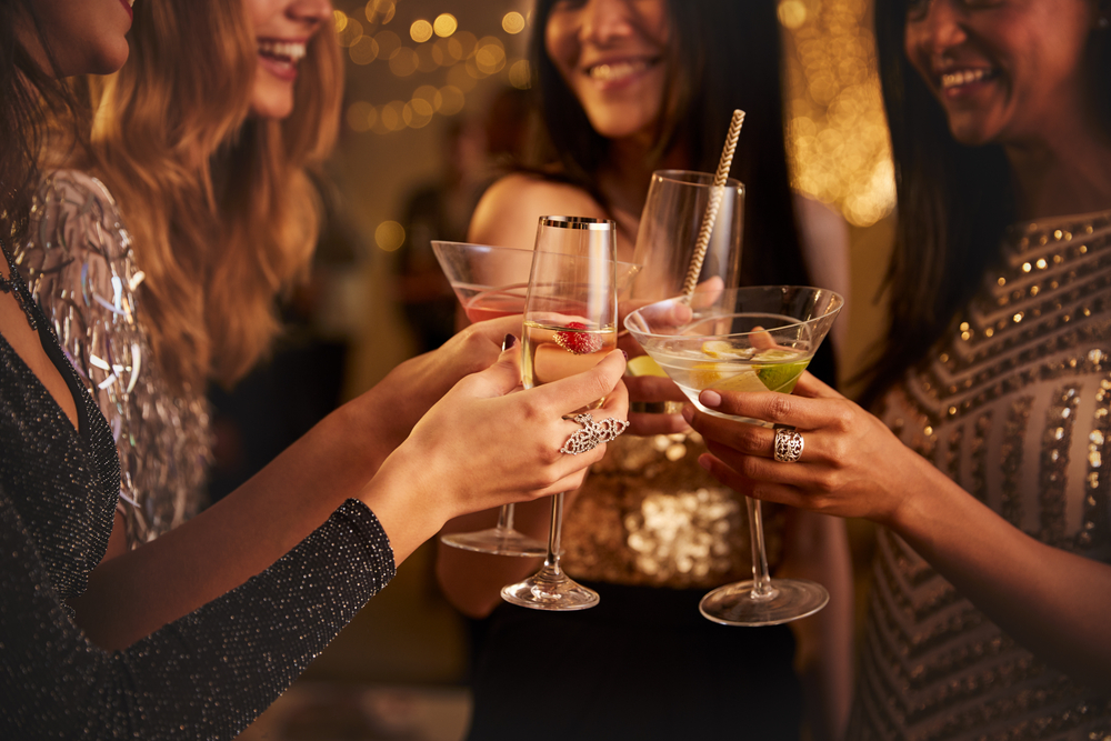 Photo of women drinking cocktails at the Tipsy Alchemist, a great addition to your Dallas Bachelorette Party.