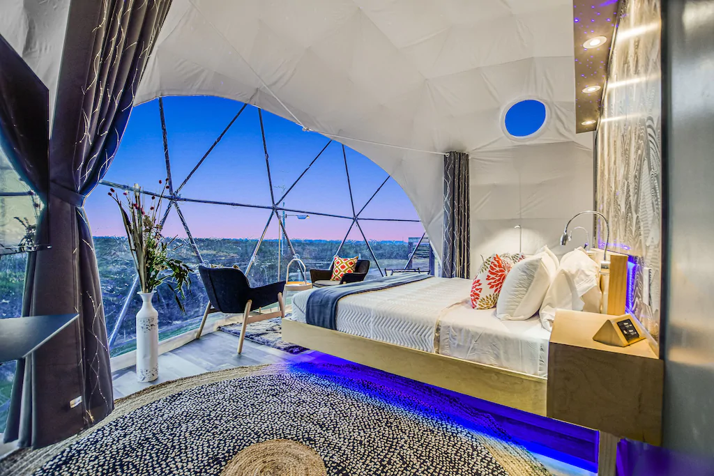 a bubble pod with a king-sized bed offering views of the countryside