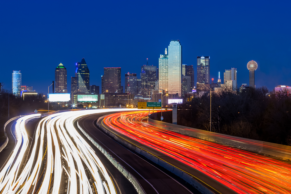 Light trails of cars on a freeway at night outside of Dallas