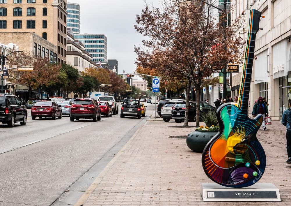 A huge guitar statue labels the entrance of East Austin, which is where to stay in Austin if you want to experience a unique and fun culture. 